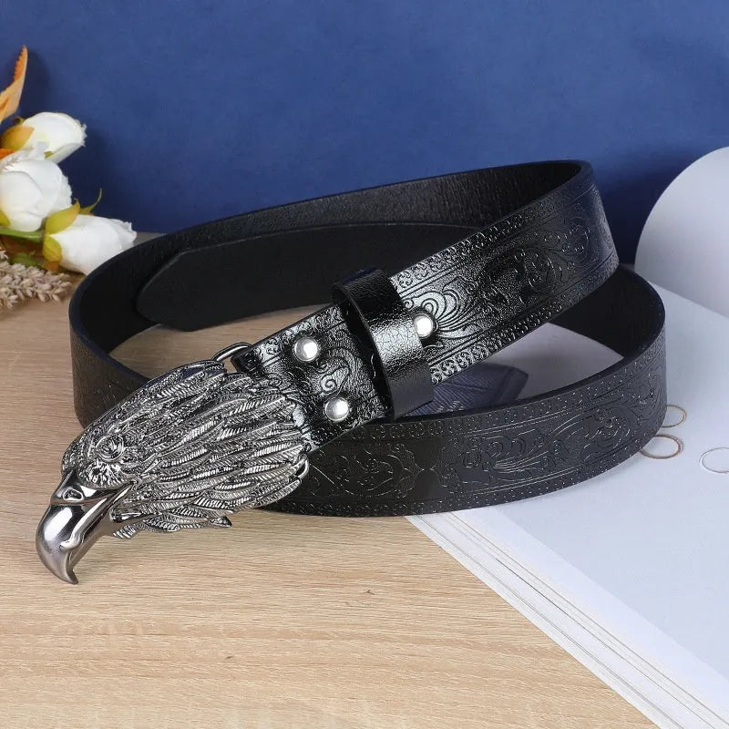 Men's brown imitation leather belt with a detailed silver alloy cow head buckle and pin buckle fastening.