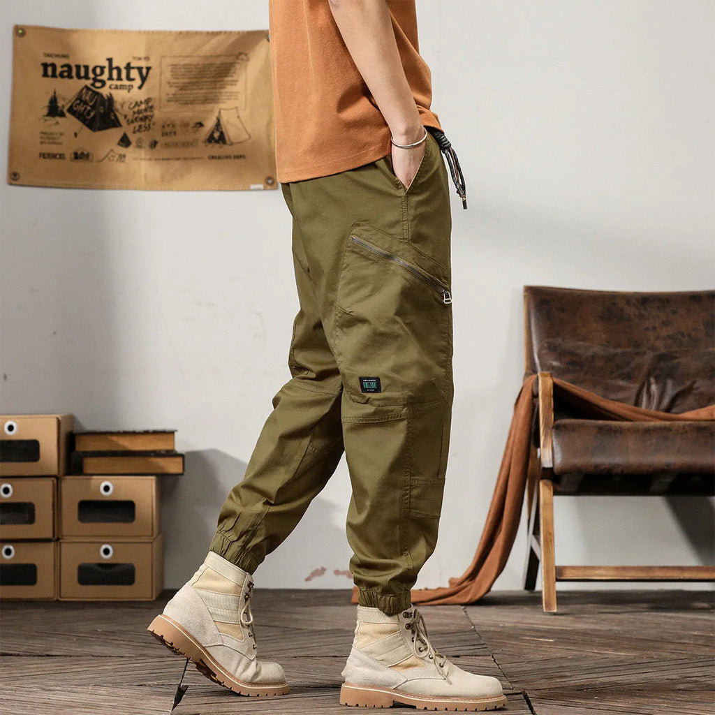 Men's tapered harem trousers in cotton with ankle band and zip placket front