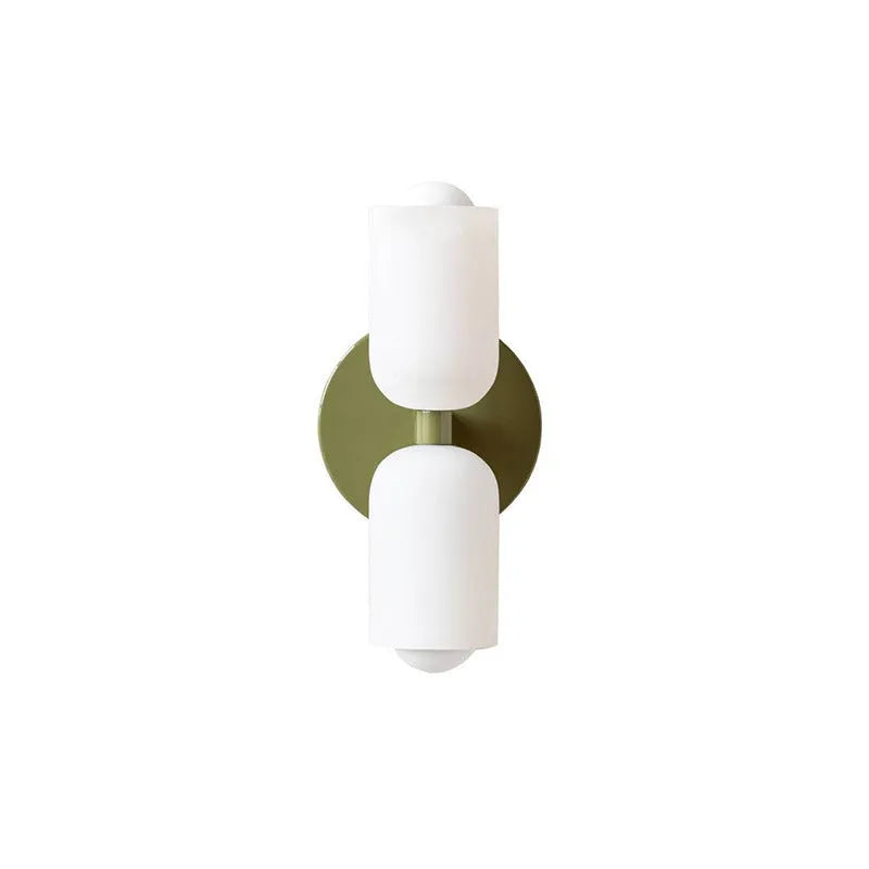 Cream base double head wall lamp with white glass shades against wall