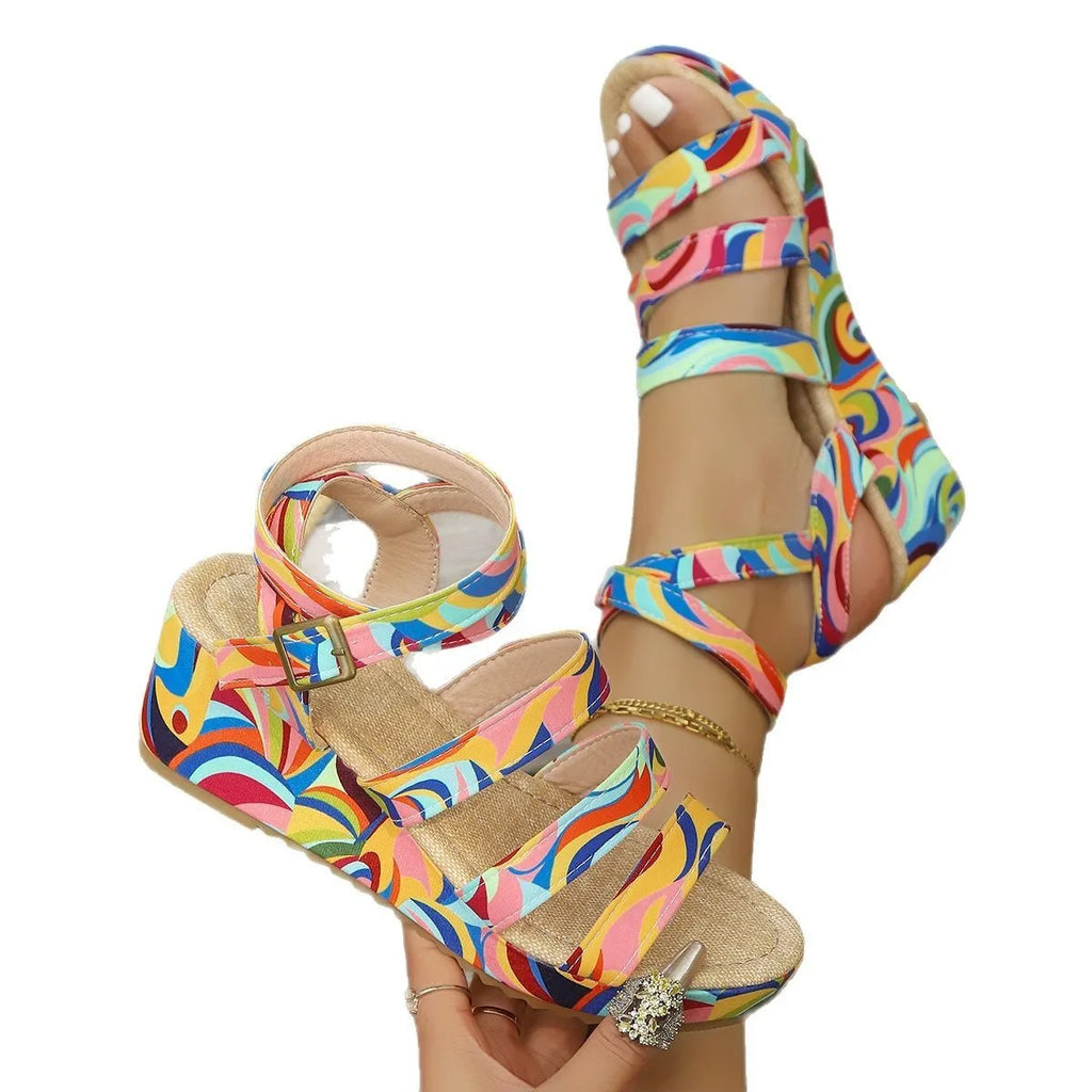 Women's wedge sandals with buckle strap showing fish mouth toe design in single colour