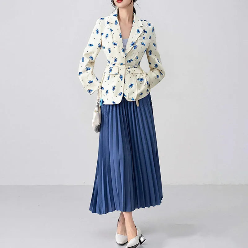 A printed suit jacket with a lace-up collar detail and waist-tightening feature on a mannequin.
