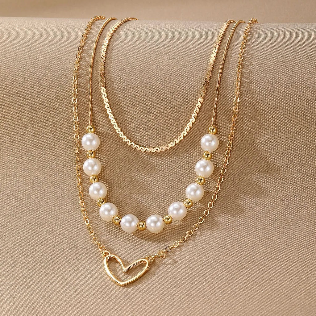 Vintage gold tone necklace with heart pendant on pearl chain, adjustable 41-50cm length