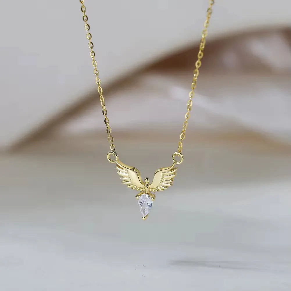 Women's silver eagle pendant necklace on an O-ring chain, shown in white gold and yellow gold electroplated finishes.