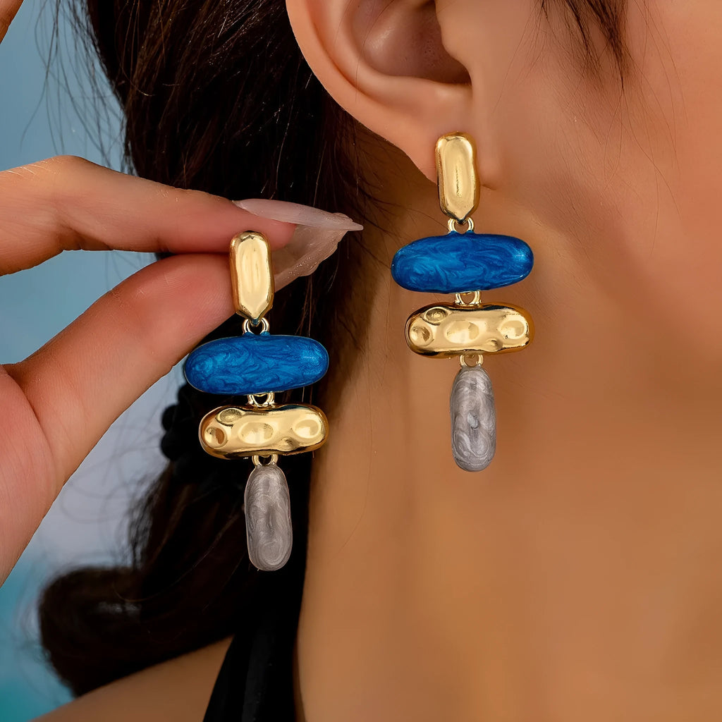 A pair of multicolour geometric stud earrings for women with a zinc alloy base and electroplated finish.