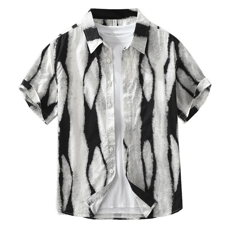 Man wearing a black and white striped retro-style short sleeve cotton shirt with a loose cardigan fit.