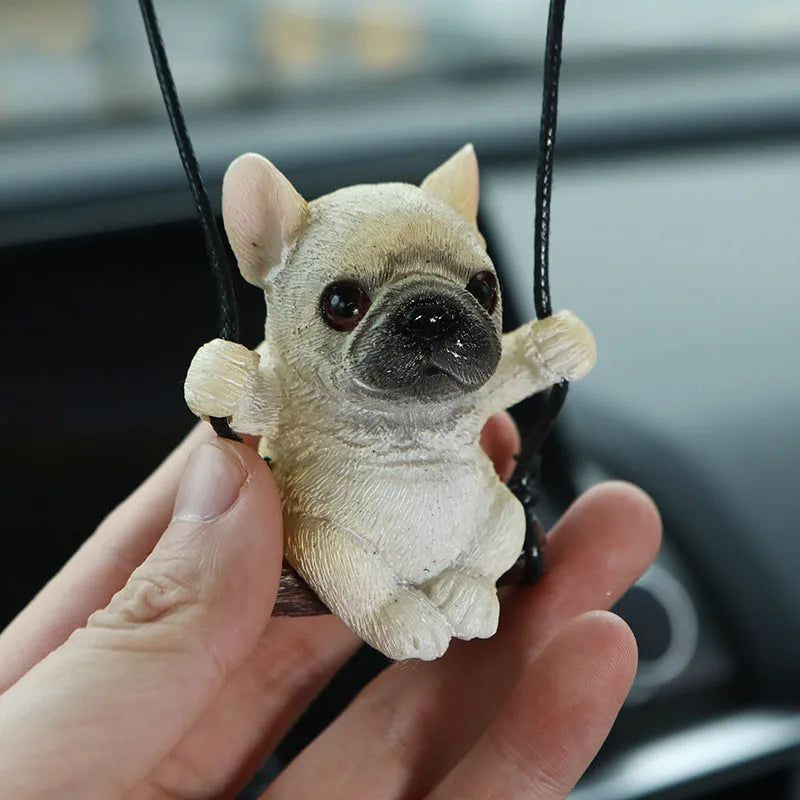 Cartoon-style resin bulldog car pendant hanging ornament in black, white, or yellow.
