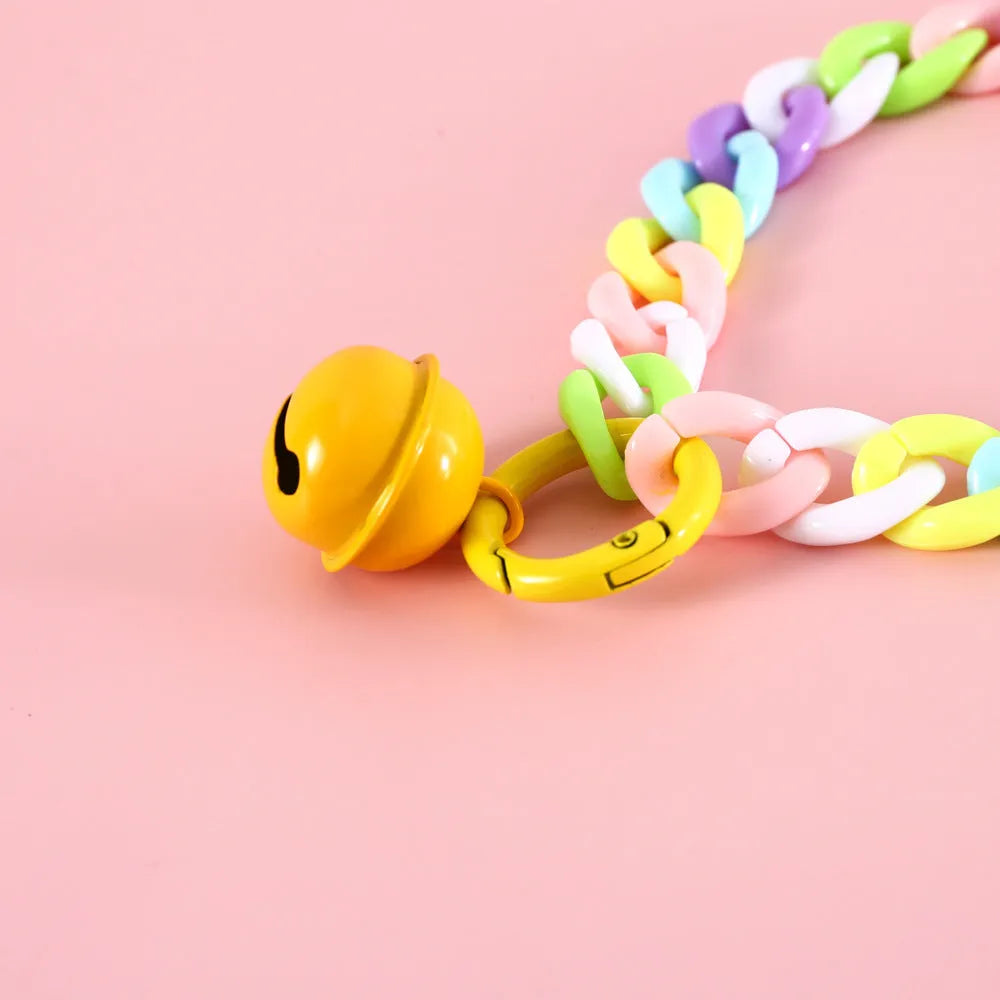 Adjustable plastic pet collar in macaron candy colours with chain detailing, shown with a buckle.