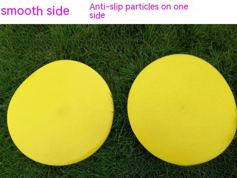 Yellow football training marker disc on grass field showing 23cm diameter flat design