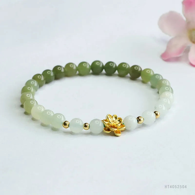Hand-woven Chinese jade bracelet with water-gradient colour pattern and flower design