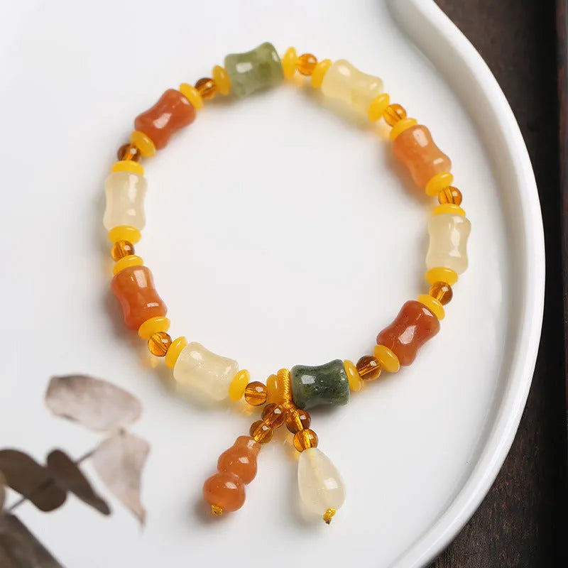 Natural Jinsi Jade small bone beads bracelet with geometric shape and auspicious patterns.