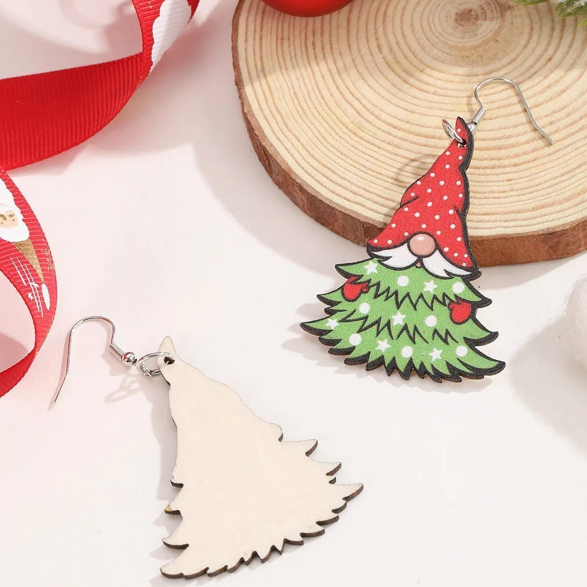 Women's wooden Christmas earrings with printed tree and snowman designs in geometric shapes