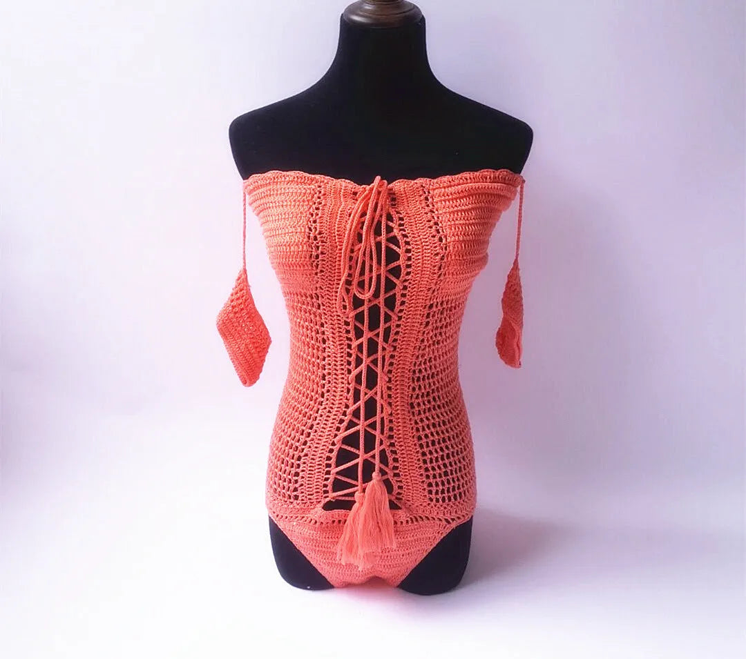 Off-shoulder one-piece swimsuit in polyester fabric on a mannequin.