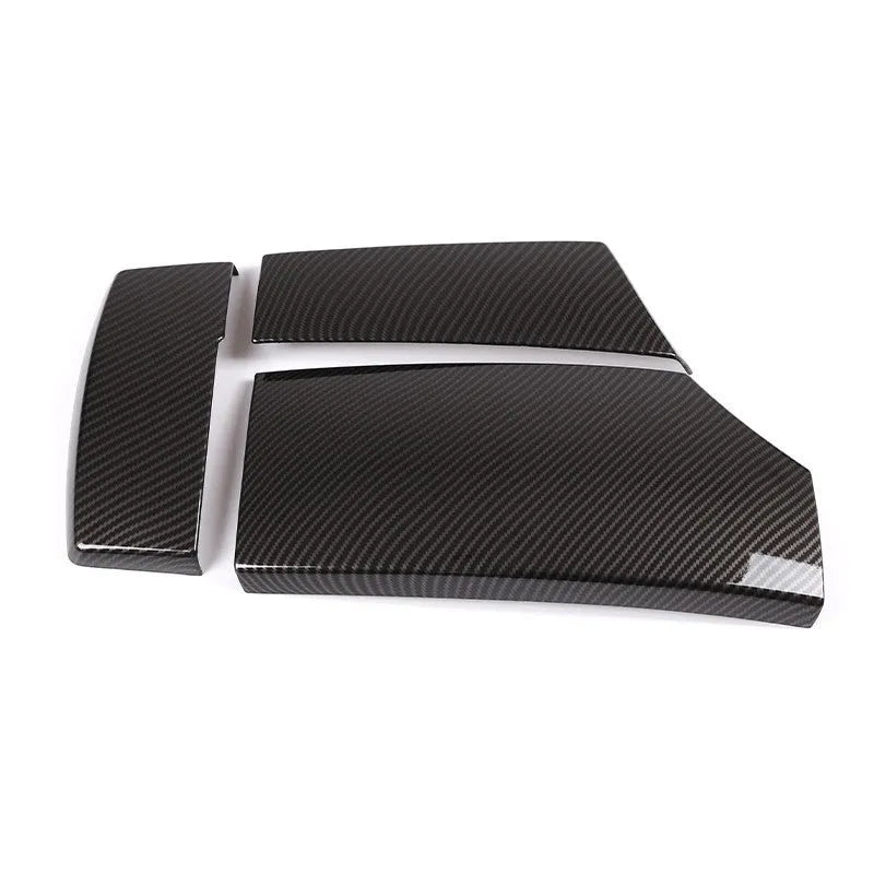 Three black ABS armrest box protective covers with a diagonal carbon fibre weave pattern.