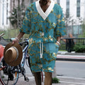 Peacock blue men's 3D printed knitted shorts suit with short-sleeve top on a mannequin