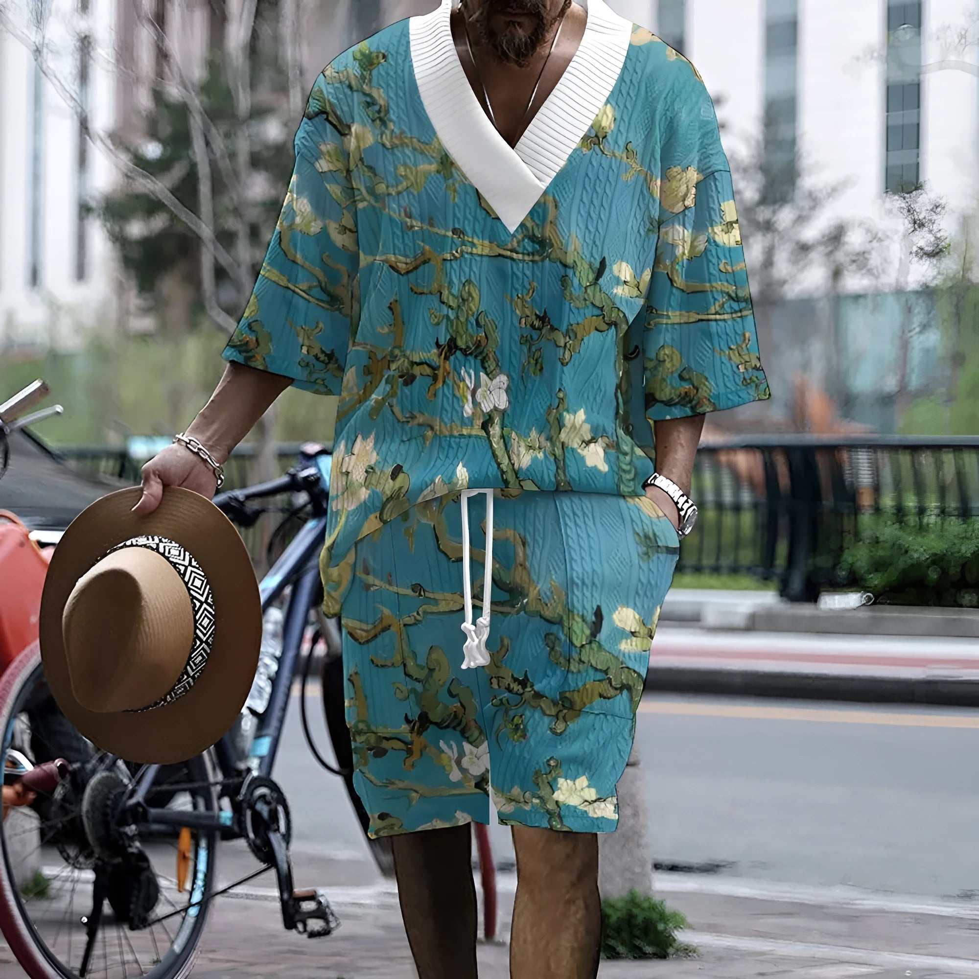 Peacock blue men's 3D printed knitted shorts suit with short-sleeve top on a mannequin