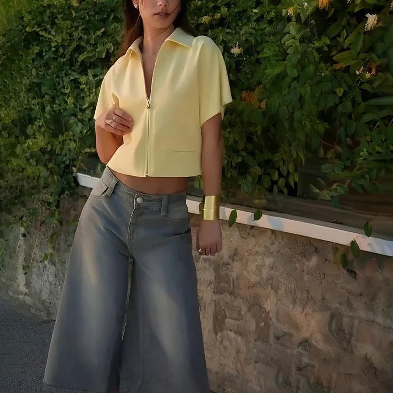 Loose-fit short-sleeve polyester casual top on a hanger, shown in white, black, and yellow colour options.