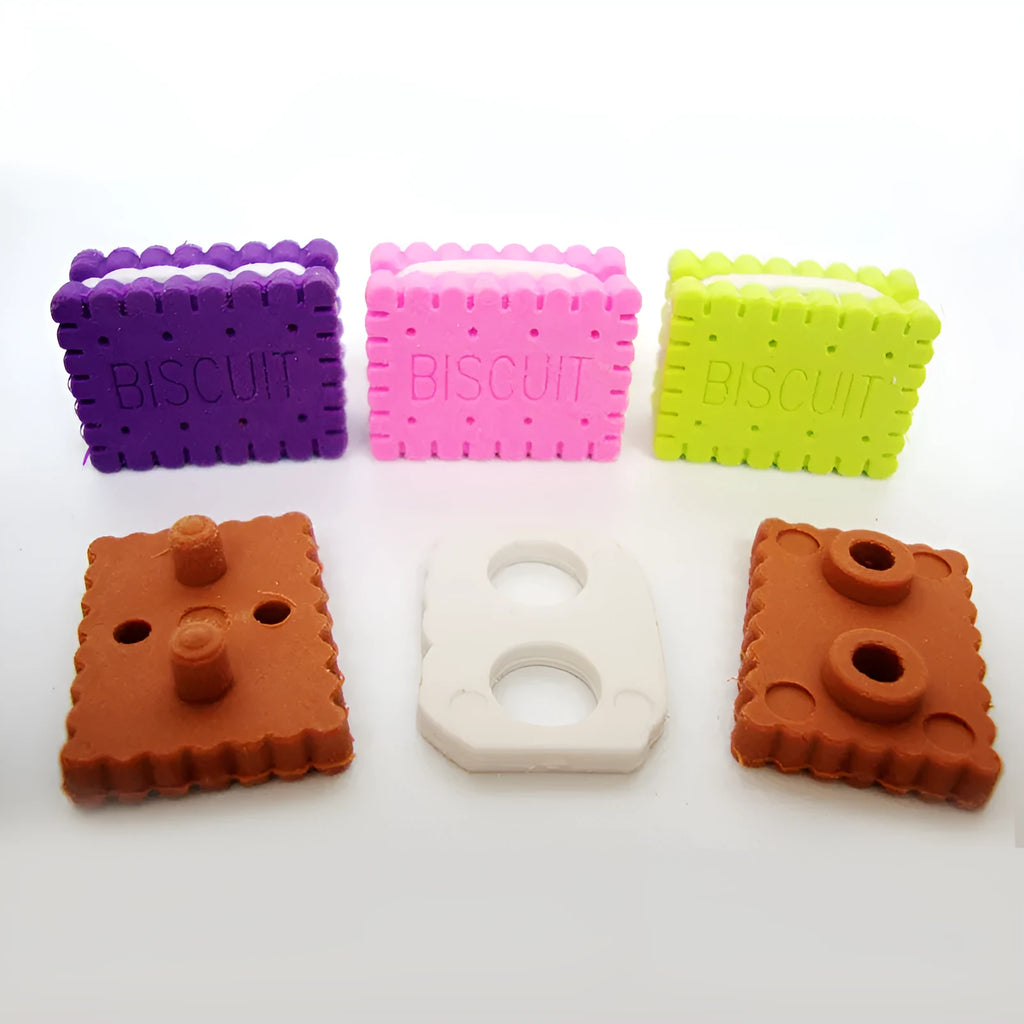 Sandwich biscuit shape eraser in brown, pink, green, or purple colour on a cake.