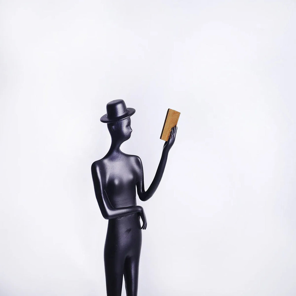 Black cast aluminium reading woman desktop sculpture modern minimalist design 51cm tall