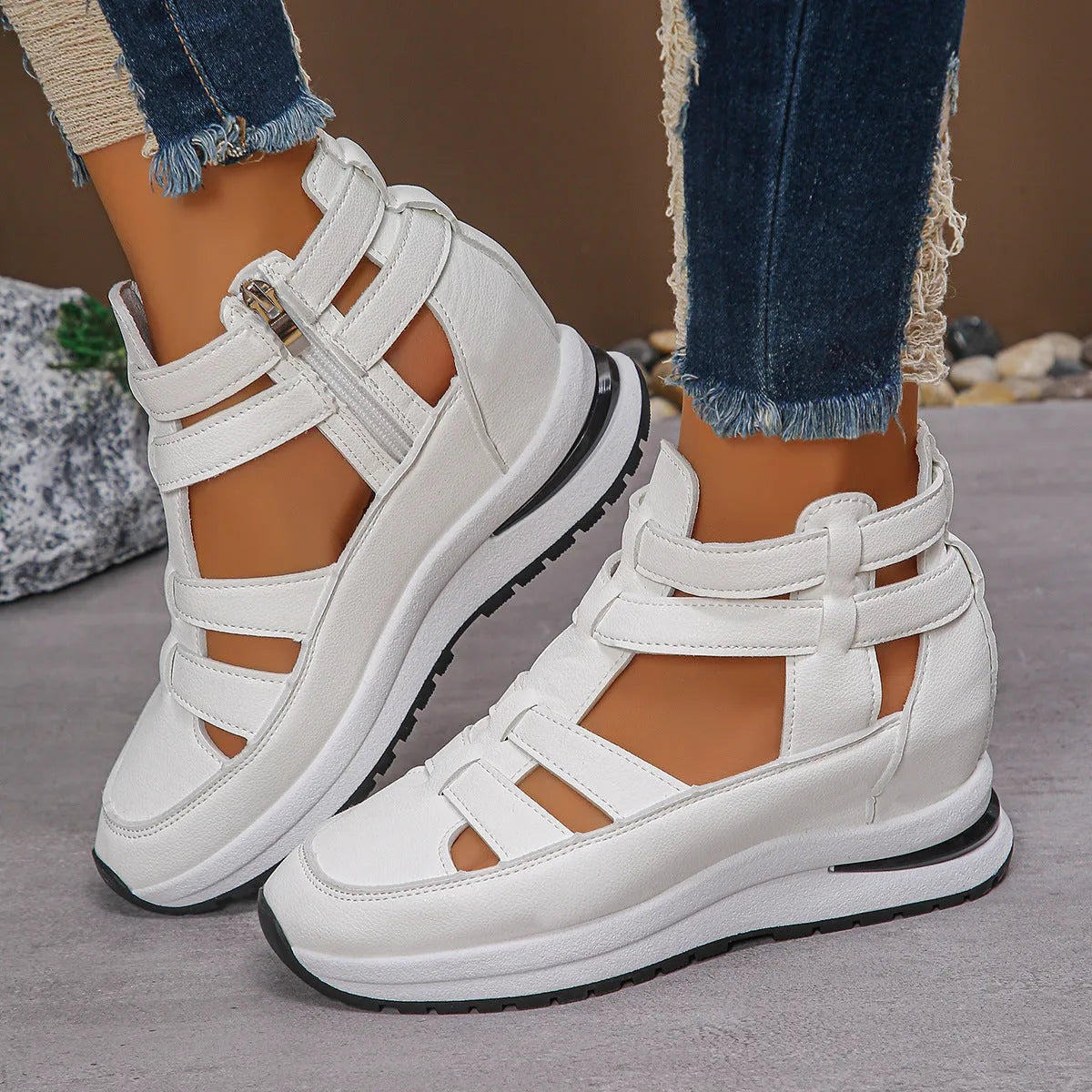 Women's black platform sandal with closed toe, hollow-out design, and Velcro ankle strap.