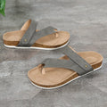 Blue thick-soled flat toe ring flip-flops on a white background.