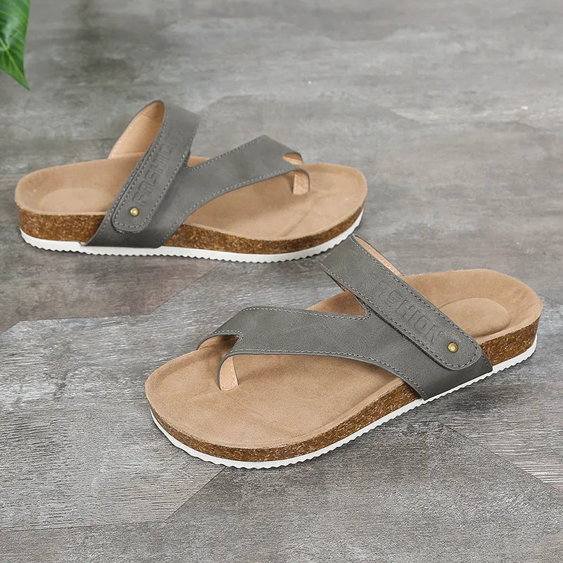 Blue thick-soled flat toe ring flip-flops on a white background.