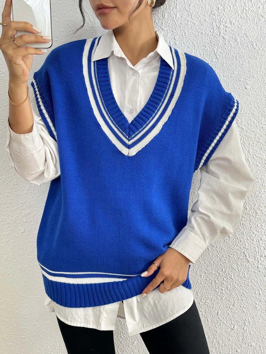 Women's loose blue college-style wool vest sweater, acrylic polyester blend, front view.