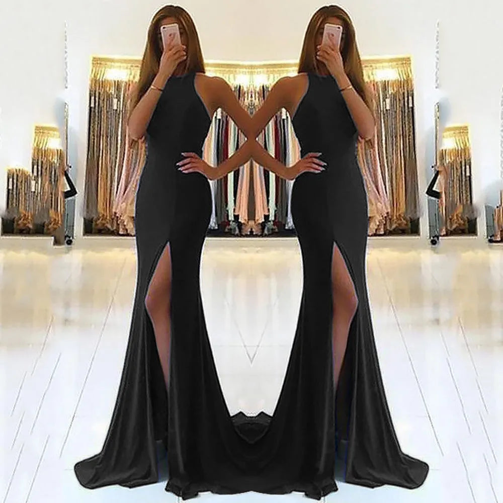 Red knitted long evening dress with high waist, large swing skirt, and hollow out detail on a mannequin.