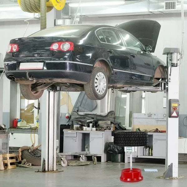Portable aluminium hub wheel balancer with bull's eye level on a black enamel finished base.