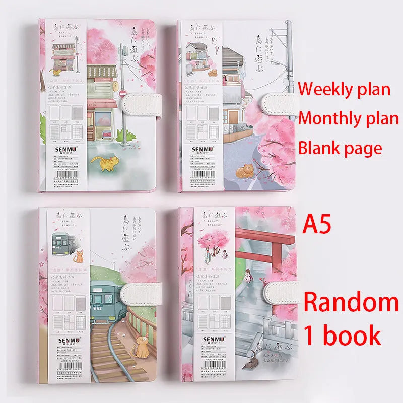 Retro style A5 wire-bound notebook open showing full-colour illustration pages, with a pen
