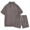 Plain polyester elastic waist shorts and short sleeve top co-ord set in beige colour.