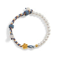 Peach-coloured sterling silver bracelet with Chinese flower weaving and pearl decoration