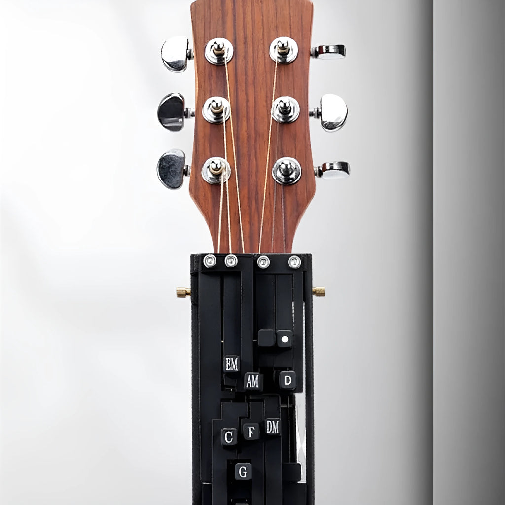 Black auxiliary guitar chord maker device with automatic gear for novice second chord practice.