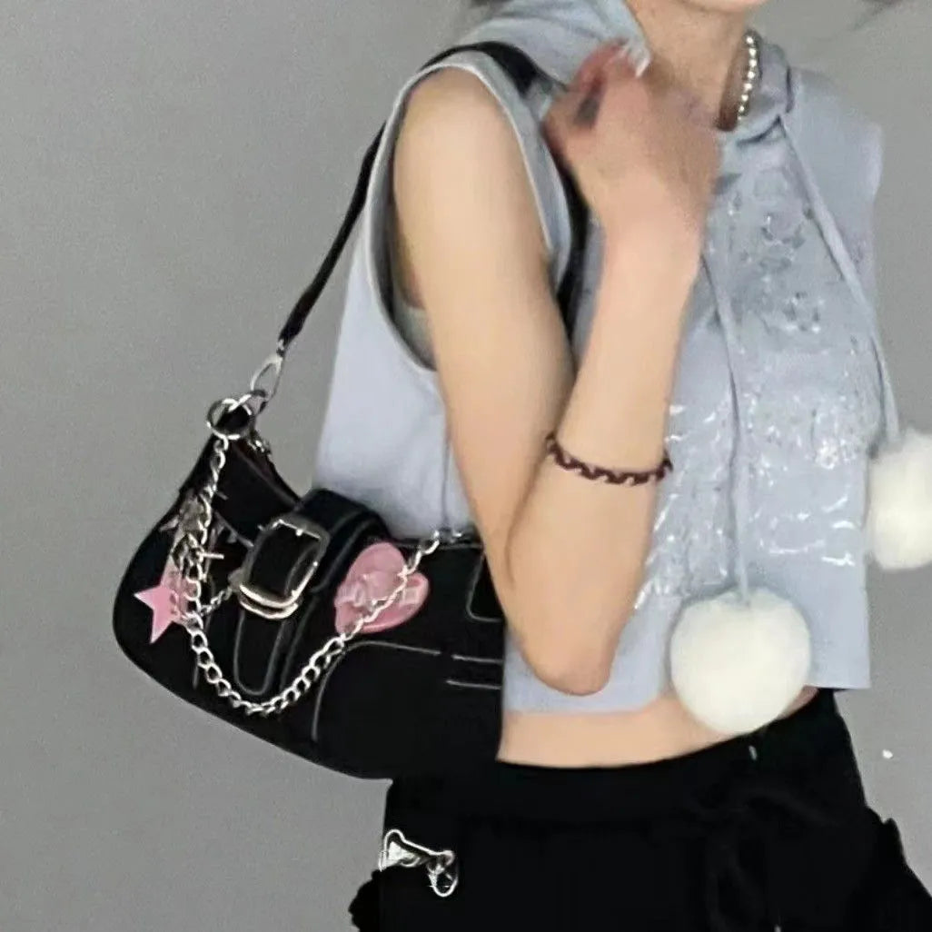 Black PU leather Y2K shoulder bag with heart butterfly shape, bow, stitching, chain, and zipper buckle
