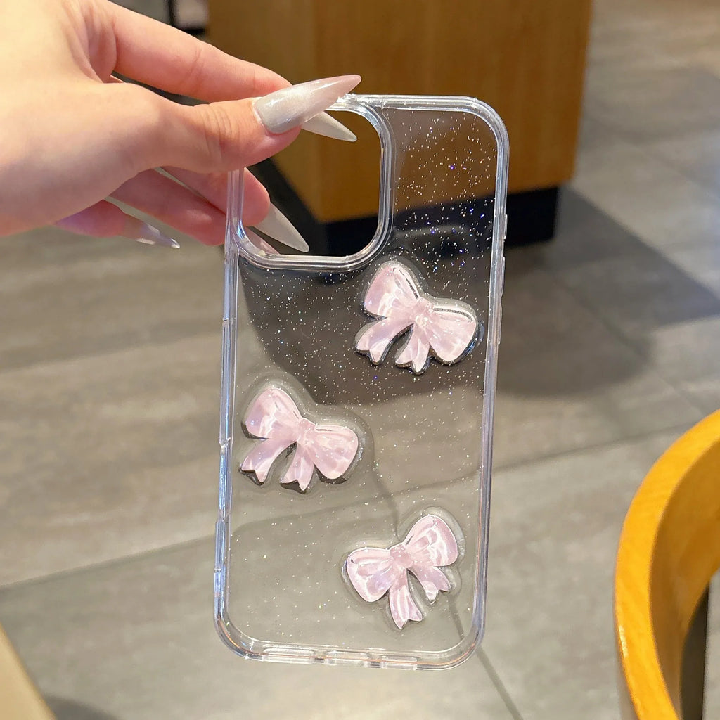 Transparent silicone iPhone case with pink bow knot and clear drop-resistant cover.