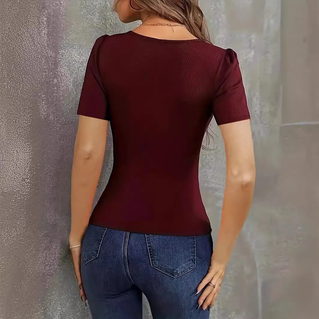 Women's wine red V-neck knitted short sleeve pullover top on a hanger.