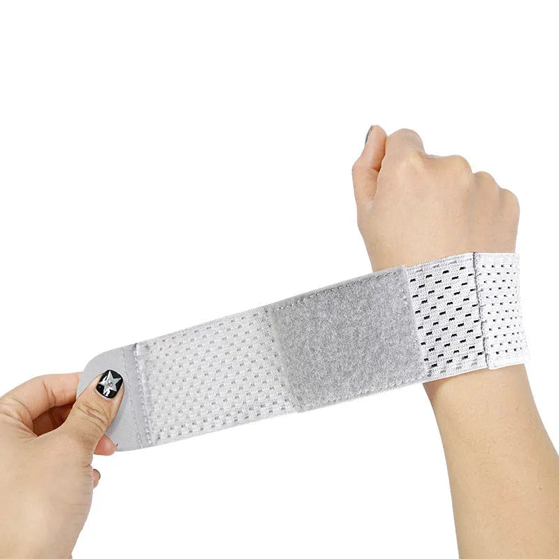 Athletic wristguards in black, gray, and pink colours showing elastic breathable fabric construction