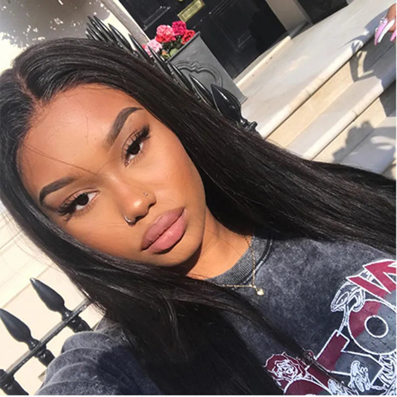 Women's long straight black synthetic wig with centre-part and bangs on a mannequin head