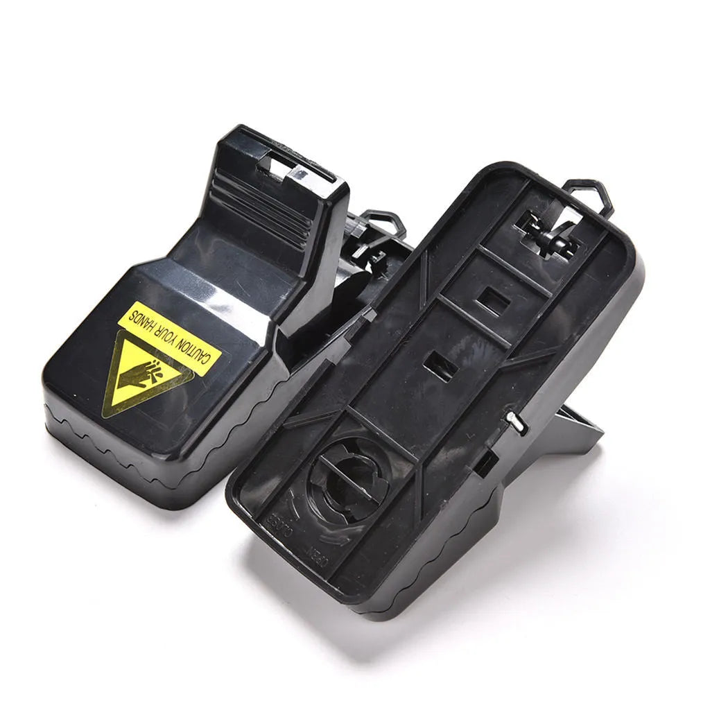 Six black plastic snapping mousetraps with dimensions 11cm long by 5cm wide