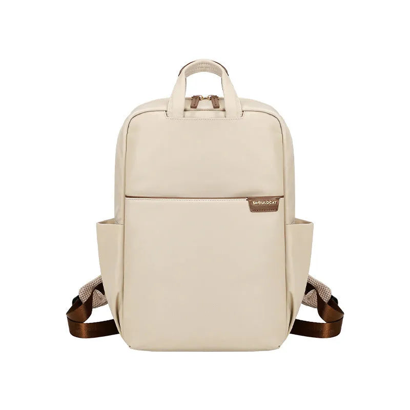 Women's nylon travel backpack showing laptop compartment and multiple internal organisers in apricot colour