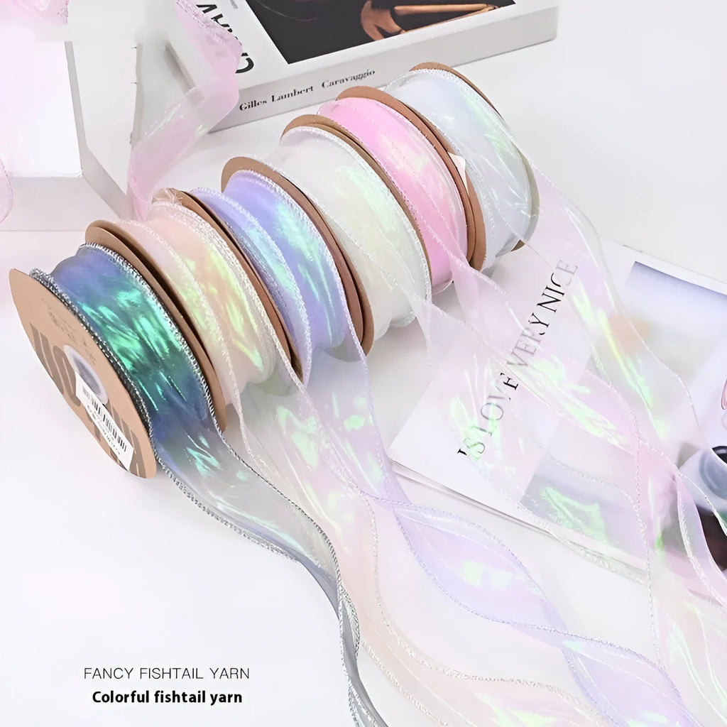 Roll of 4cm wide colourful mesh ribbon with fishtail yarn floral wave design.