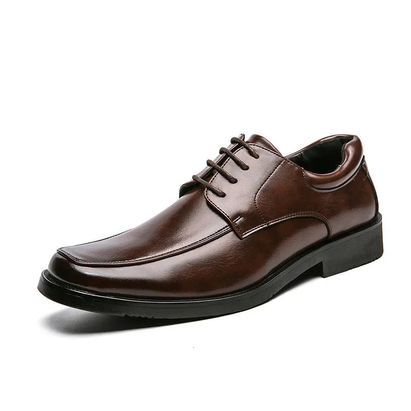 Men's black square toe low-top business casual shoes with a rubber sole.