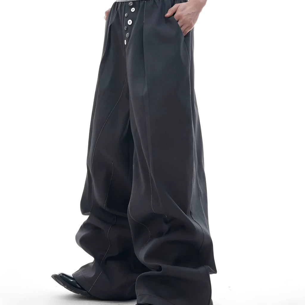 Straight-leg high-waisted casual trousers with a button-open front seam detail in black.
