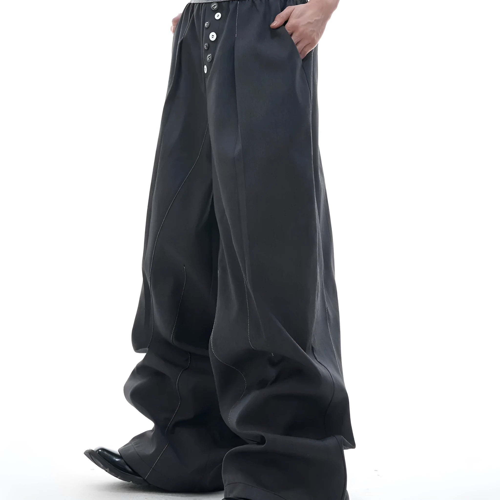 Straight-leg high-waisted casual trousers with a button-open front seam detail in black.