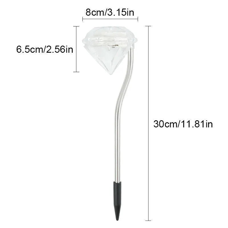 White solar-powered garden spotlight with adjustable lighting angle on a fence post.