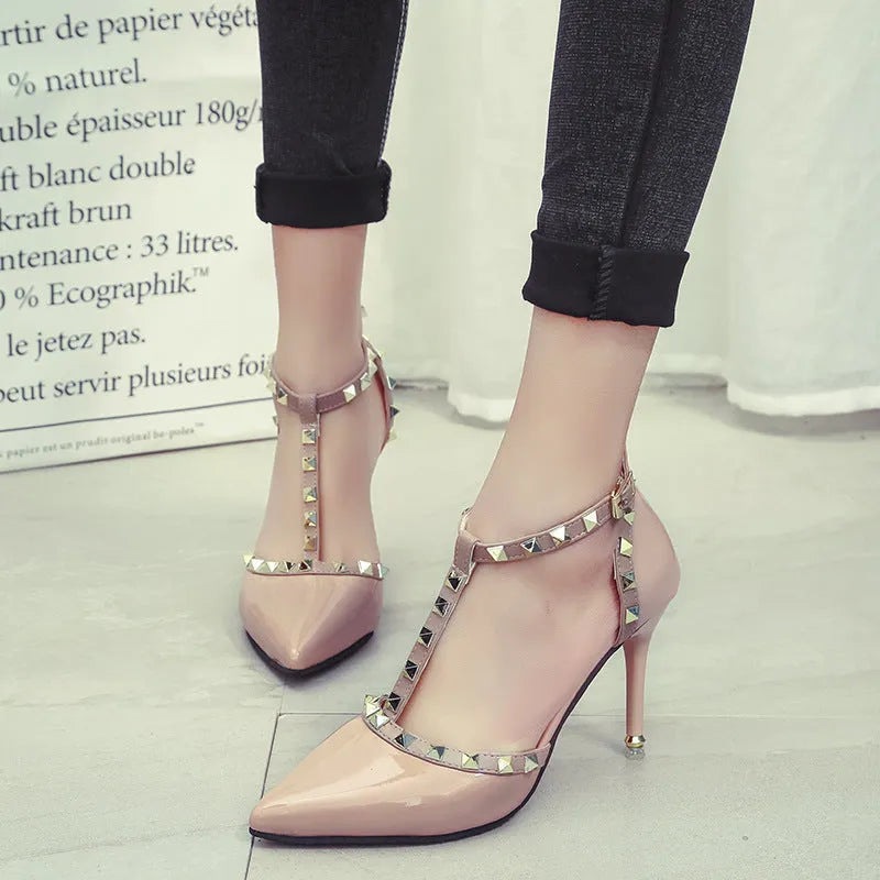 Studded pointed high heels in Black with stiletto heel and buckle fastening