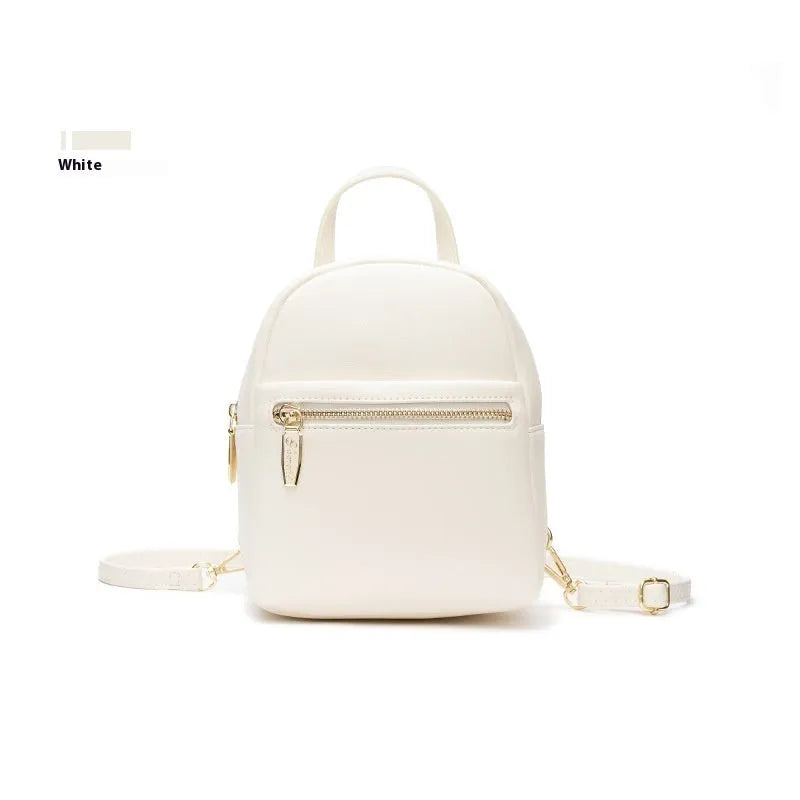 Soft PU mini backpack in street trend style with contrast colour detailing and external pocket.