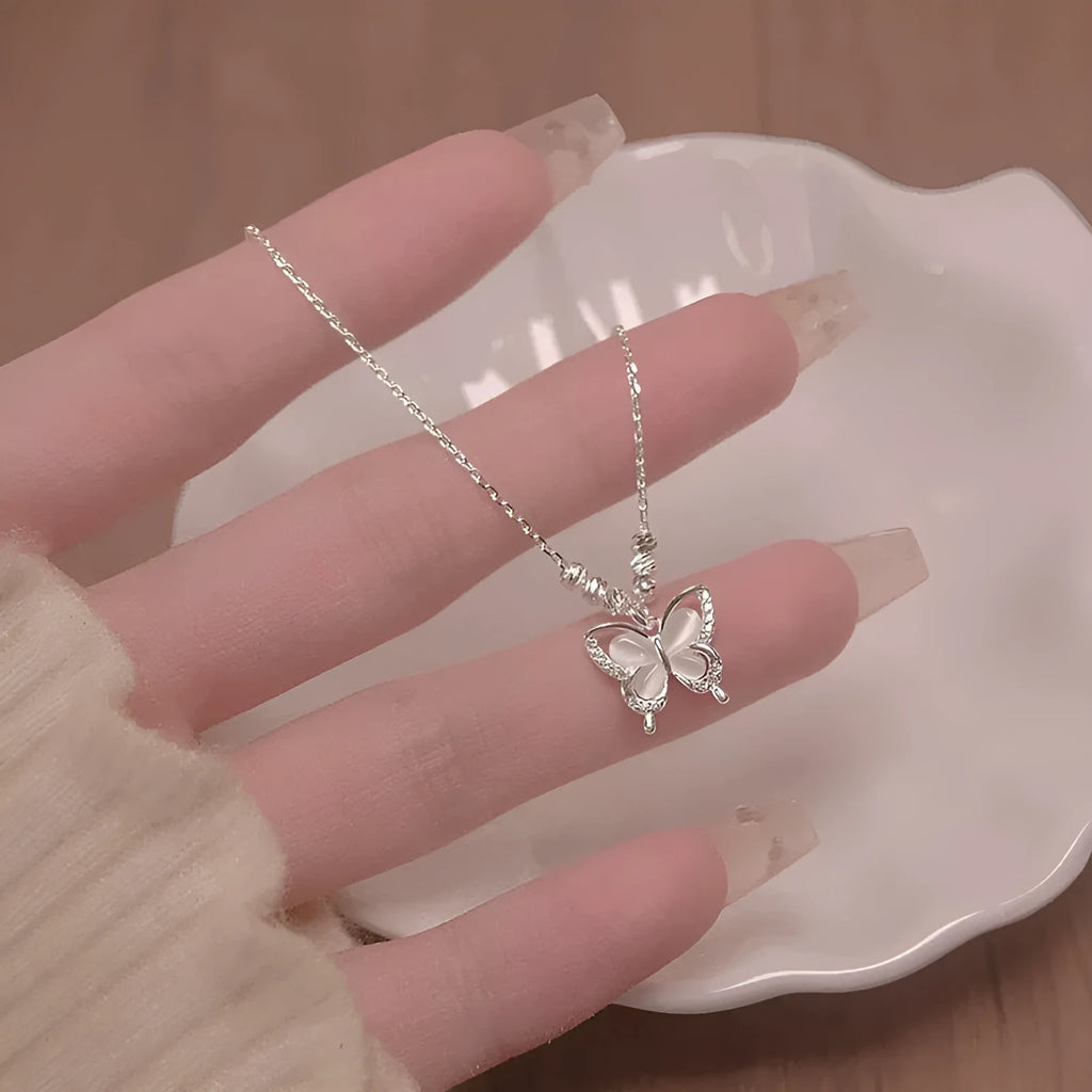 Silver-colour women's butterfly pendant necklace on a cross chain, showing adjustable length between 41cm and 50cm.