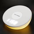 White 10W wireless phone charger with digital clock display and control buttons.