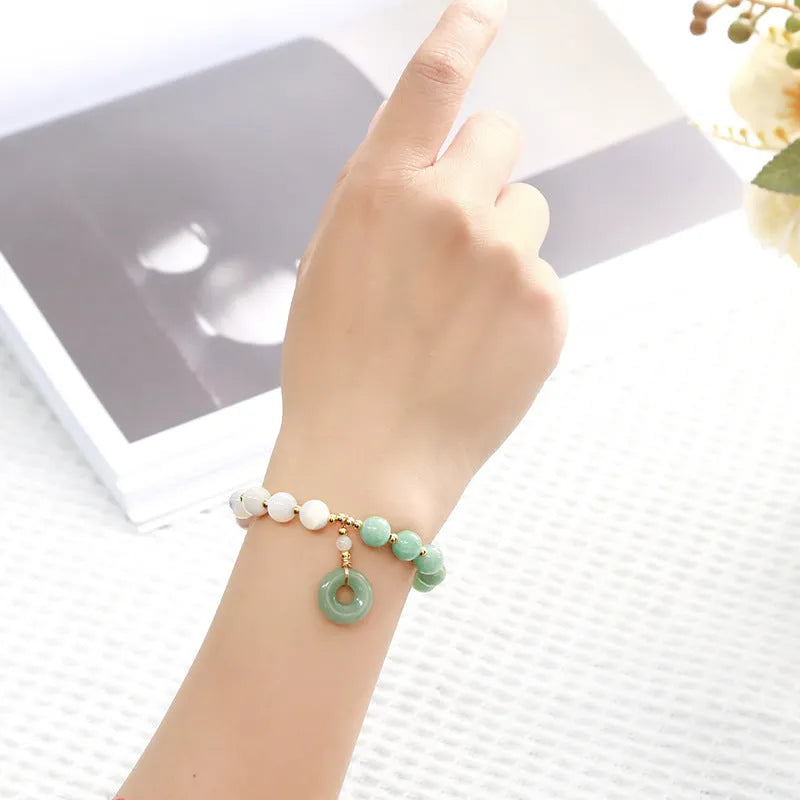 Blue Burma jade bracelet with copper horseshoe screw safety buckle and geometric design