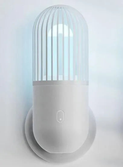 Portable capsule UVC disinfection lamp in four colours with dimensions 64x64x148mm